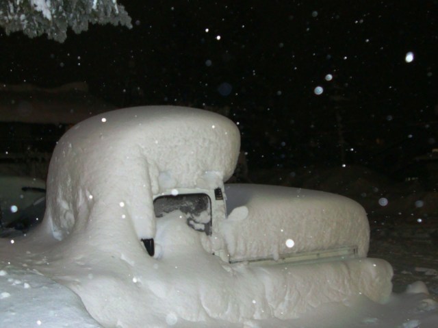 Truck covered in snow